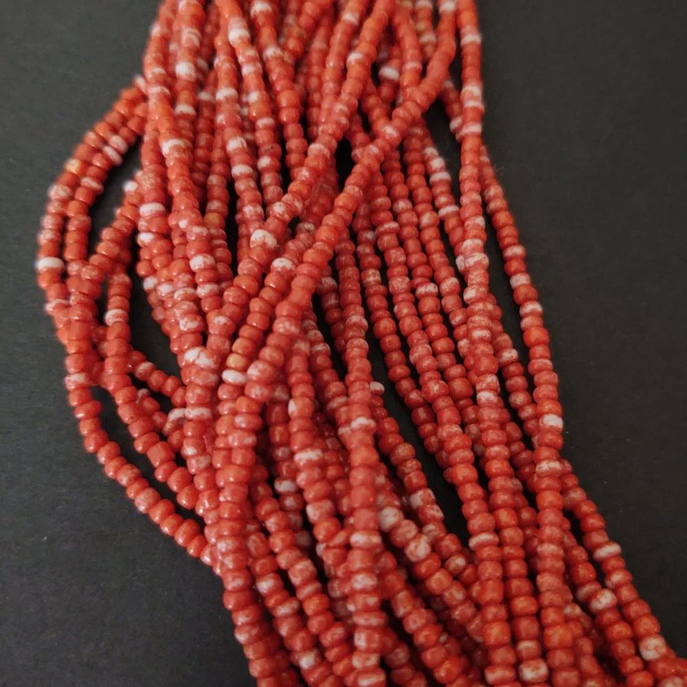 Orange and white multi strand seed bead necklace